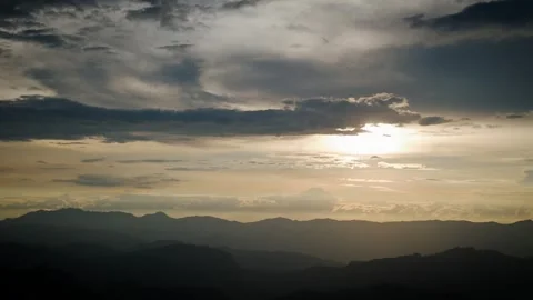 Incandescent Glow Piercing Through Tempestuous Dark Cloudbanks Stock Footage 316797641