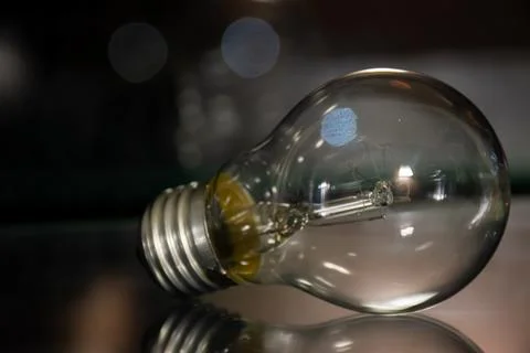 An incandescent lamp is an artificial light source Stock Photos