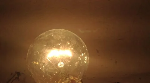 Incandescent Lamp Flickers yellow in The Dark Close up Stock Footage 58299524
