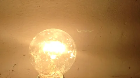 Incandescent Lamp Flickers yellow in The Dark Close up 2 Stock Footage 58299550