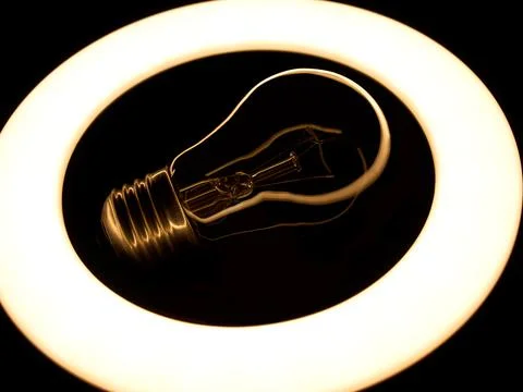 Incandescent lamp inside LED ring light source Concept photography, the light Stock-Fotos