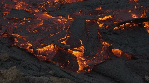 Incandescent lava flows under earth crus... | Stock Video | Pond5