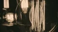 Incandescent tungsten filament trembling in light bulb, creative interior design HD Footage