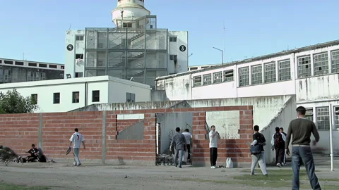 Incarcerated Men Gathering in Exercise Yard, Argentina Prison - 4K Stock Footage 329732573