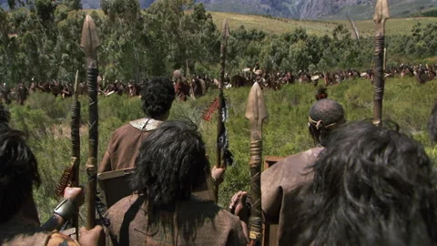 Incas and Chankas face each other across a field holding spears Stock Footage 202904168