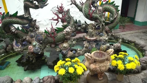 Incense and Flowers for a Dragon at a Buddhist Stock Footage