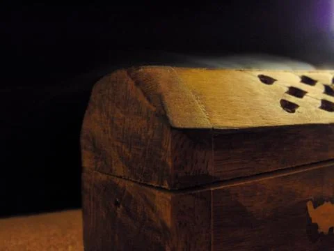Incense box on a rustic table. Stock Photos