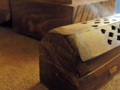Incense box on a rustic table. Stock Photos