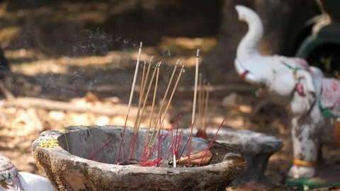 Incense buddhist offering burning at Wat Phu ancient temple in Champassak, Laos Stock Footage 124396895