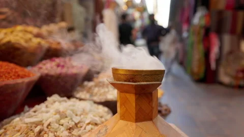 Incense burning alongside colored spices, Dubai, UAE Vídeo Stock 220082205