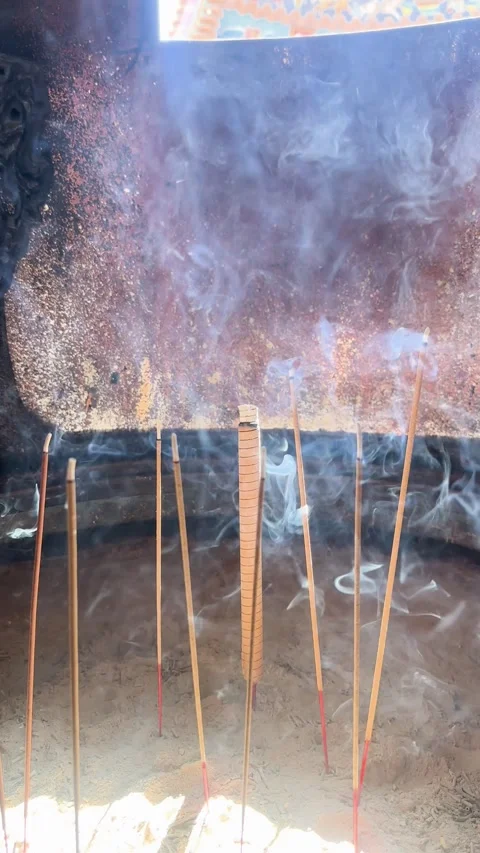 Incense burning in Taiwan temple with divine light and smoke Stock Footage 329555993