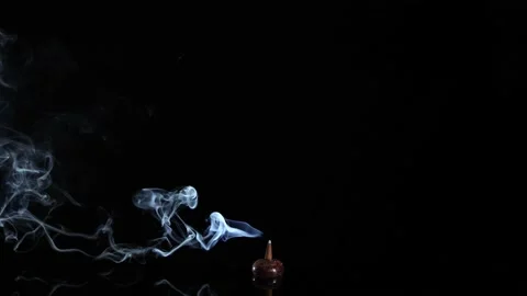 Incense cone burning with intense and soft smoke on dark background, meditation  Stock Footage 237253206