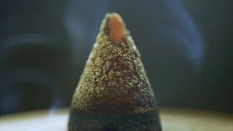Incense cone burning macro holidays decoration Stock-Footage 127384867