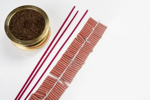 Incense with the pot and string of Chinese firecrackers on the rope on a wh.. Stock Photos