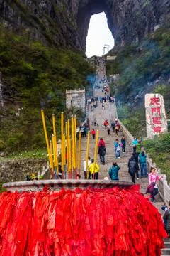 Incense pot on the bottom platform and tourists climbing 999 stairs to Haven Stock Photos
