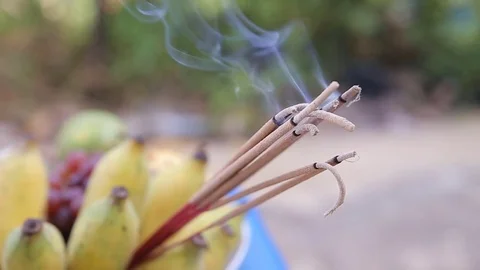 Incense smoke in blurred grass background.HD video Stock Footage 80773822
