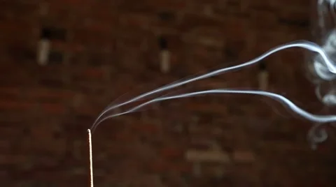 Incense smoke with brick wall in background Stock-Footage 63314104