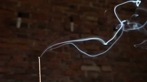 Incense smoke with brick wall in background Stock Footage 63314208