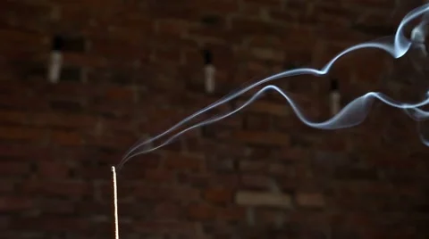 Incense smoke with brick wall in background Stock Footage 63314254