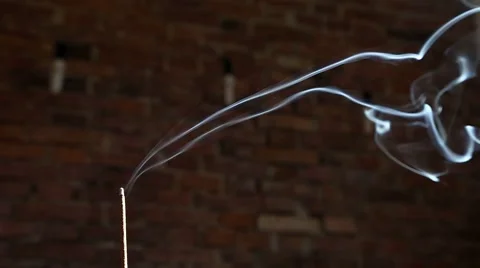 Incense smoke with brick wall in background Stock Footage 63314384