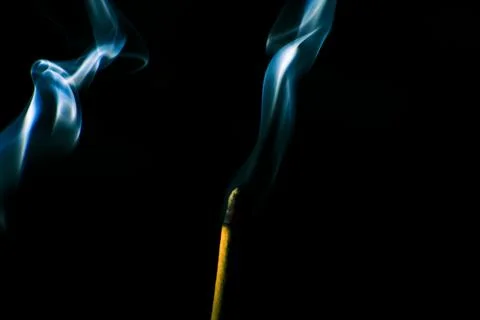 Incense smoke creates a variety of pattern shapes on a black background 스톡 사진