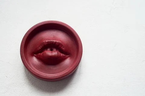 Incense stand red lips. Round shape on a white background. Esotericism Stock Photos