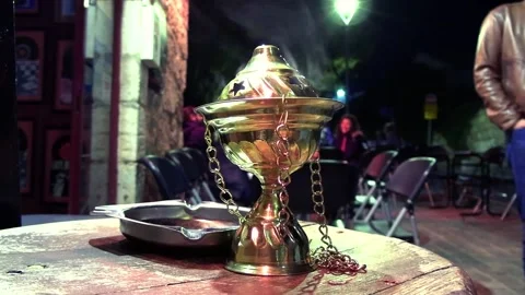 Incense steaming on table at night time Video stock 235317201