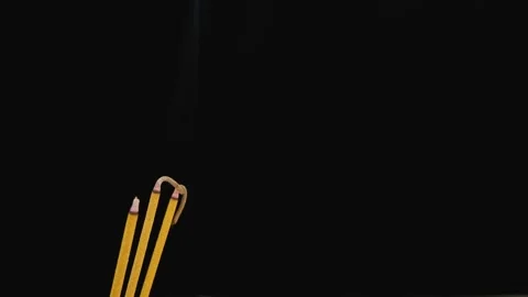 Incense sticks burning on black background Stock Footage 277180174