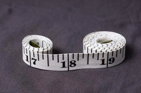 Inch, centimeter tape tailor folded in the form of eight Stock Photos