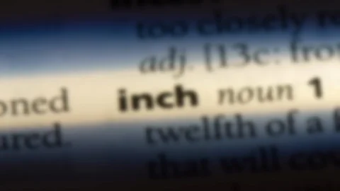 Inch word in a dictionary. Stock Footage 99561062