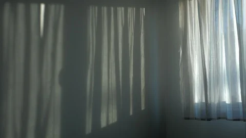 The incident light from the window moves along the wall. Video stock 103838929