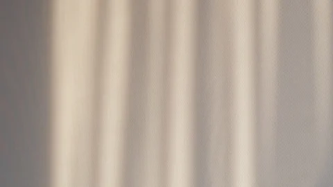 The incident light from the window moves along the wall, the shadow of the Stock Footage 127763269