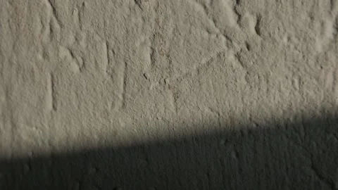 The incident light from the window moves along the wall, goes into darkness. Stock Footage 146094341