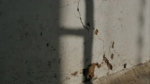 The incident light from the window moves along the old wall. Video stock 151750515