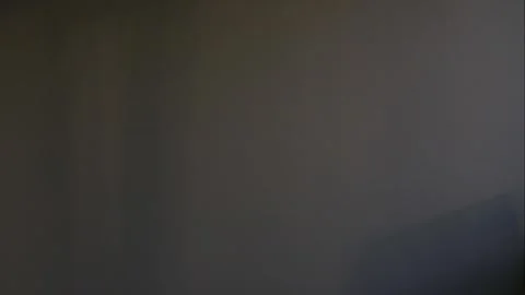 The incident light from the window moves along the wall. Stock Footage 246411109
