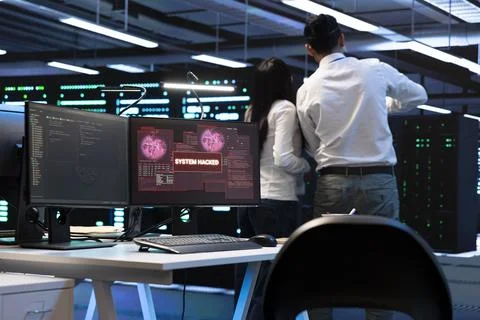 Incident response, teamwork and cybersecurity in data center with hacked screen 스톡 사진