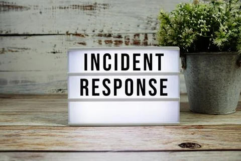 Incident Response text on light box with alarm clock on wooden background Stock Photos