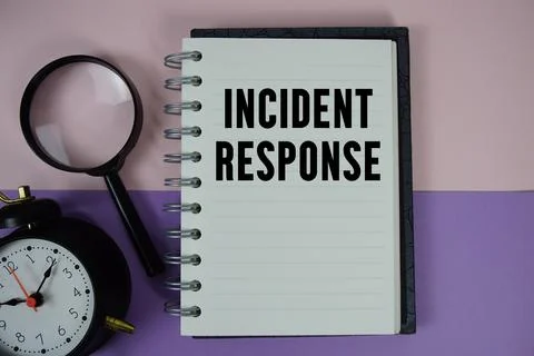 Incident Response text written on notebook paper with magnifying glass and .. Stock Photos