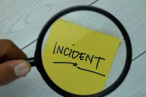 Incident write on sticky notes isolated on Wooden Table. Stock Photos