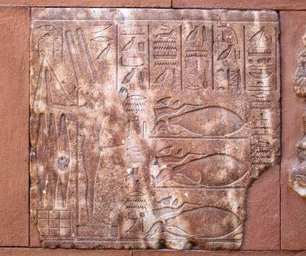 Incised blocks making up part of the reconstructed red chapel or Chapelle Rou Foto stock