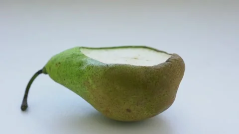 Incised rotten pear fruit isolated on white background close view Stock Footage 172503045