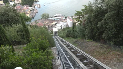 Inclined elevator track overlooking Riva del Garda and Lake Garda, Italy Stock Footage 341335077