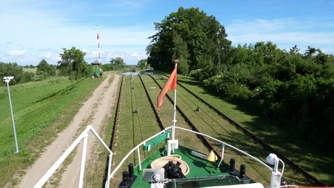 Inclined planes. Sailing over the grass. The boat is sailing through grass Stock Footage