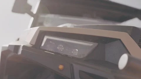 The inclusion of dimensions, low beam and high beam in the headlight block of a Stock Footage 253639641