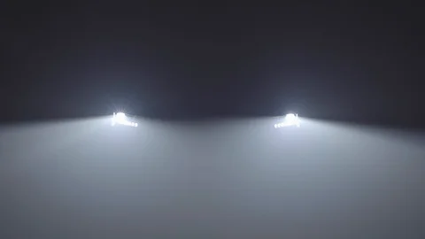 Inclusion of headlights of the car, headlights light up, light in a fog Stock Footage 129104599