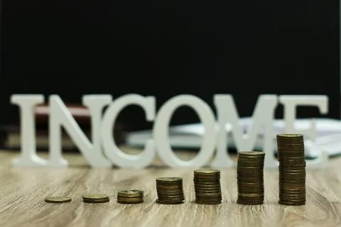 Income coin stack text letter Stockfoto's