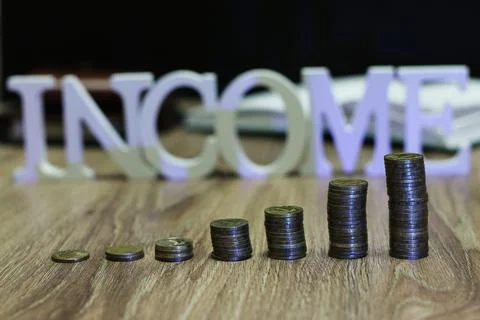 Income coin stack text letter Stockfoto's