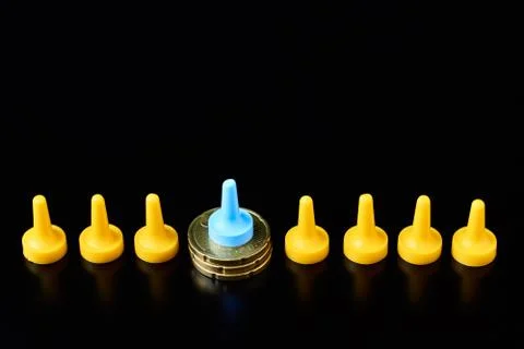 Income differences between rich and poor concept. Board game figure on pile o Stock Photos