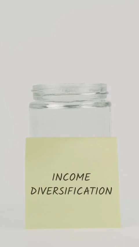 Income diversification text or word on yellow sticky note attached to glass Stock Footage 311742931