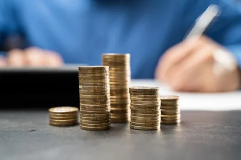 Income Tax And Saving Money Coins Stock Photos